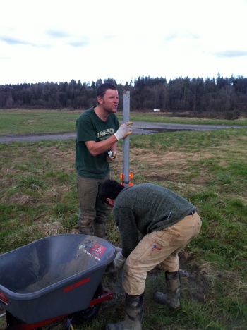Brady and Jason setting posts on our seedling greenhouse.